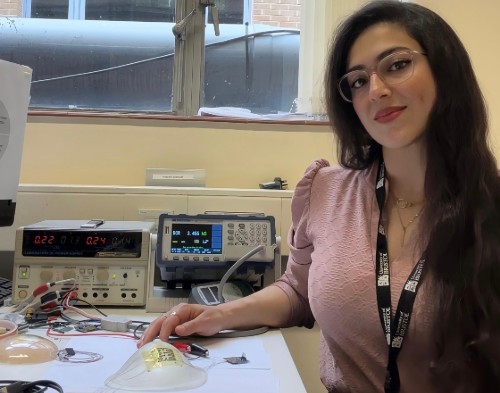 Marah Alassaf, a PhD student in Digital Health and Care at the University of Bristol, in a lab with the temperature-sensing breast patch.